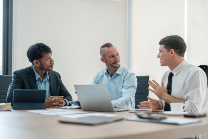three men meeting